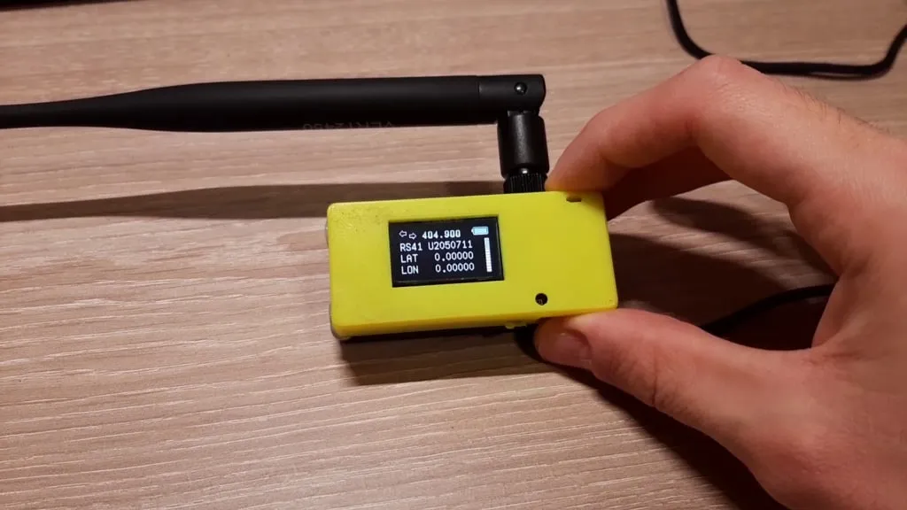 The yellow portable receiver, with its antenna and a screen showing the sonde’s data